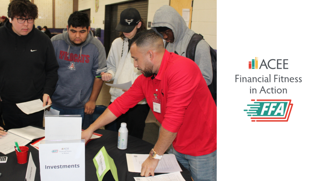 Photo of a volunteer and students at the Wickenburg HS Financial Fitness in Action event